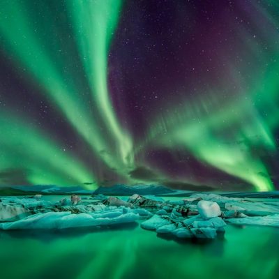 Spectacular Northern Lights Dancing over Jökulsárlón Glacier Lagoon in Iceland