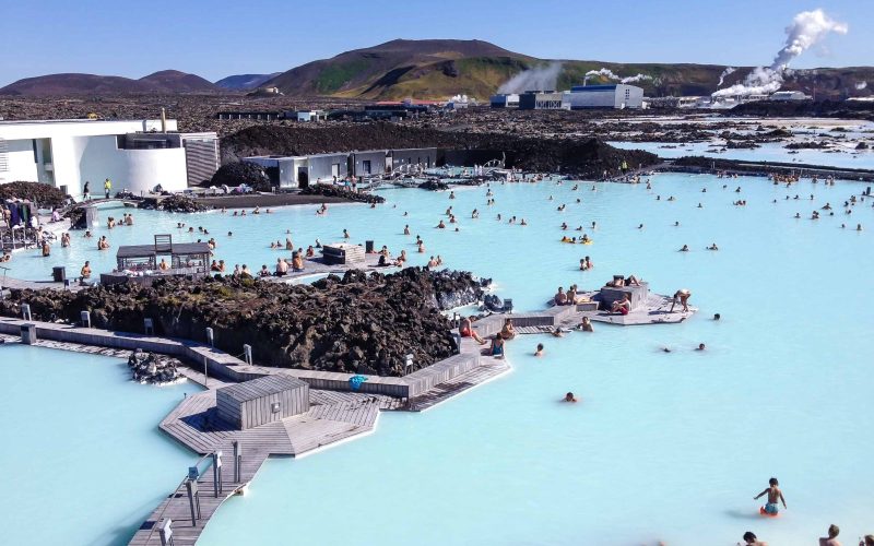 View Of People Bathing In The Blue Lagoon During A Private Luxury Transfer From Keflavik Airport To Reykjavik