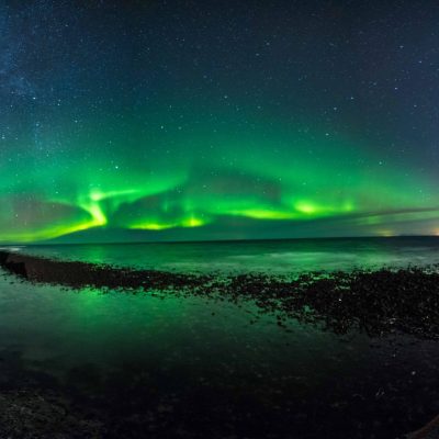 Northern Lights Show Over the Atlantic Ocean in Iceland