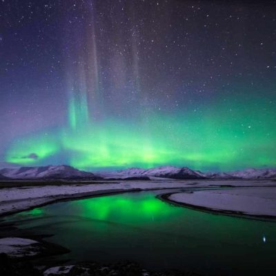 Beautiful Northern Lights Over Snow Covered Icelandic Landscape