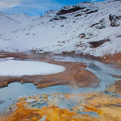 The Colorful Hills of Seltun Geothermal Area Covered in Snow During Winter on Reykjanes Peninsula